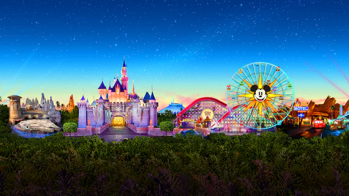 Disneyland Park and Disney California Adventure landmarks beneath a starry sky